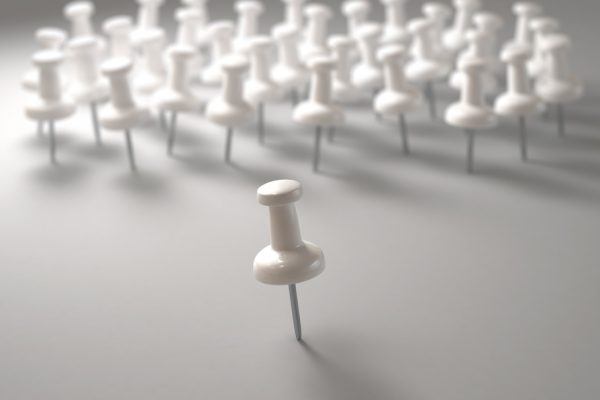 3D illustration. White pin in front of everyone in the concept of leadership.